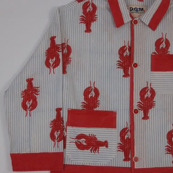 Baby romper with red lobster pattern on a white background