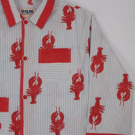 Red and white sports jersey with lobster patterns on a white background