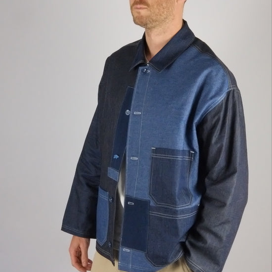 a patchwork denim jacket on a white background 