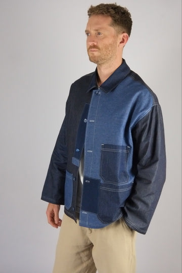 a patchwork denim jacket on a white background 
