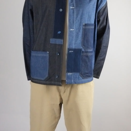 a patchwork denim jacket on a white background 