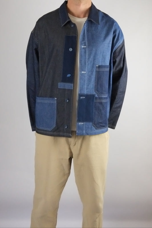 a patchwork denim jacket on a white background 