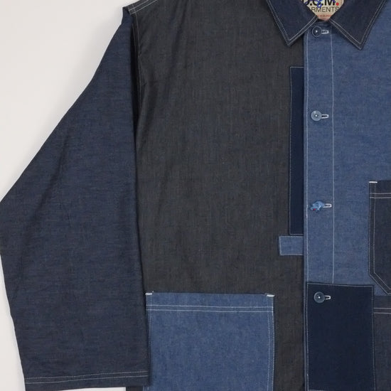 a patchwork denim jacket on a white background 