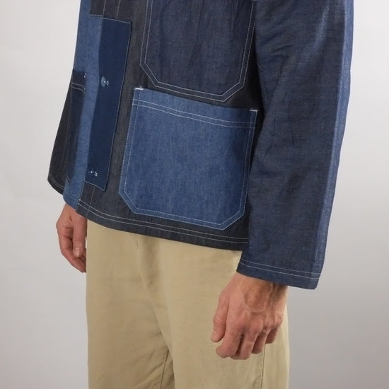 a patchwork denim jacket on a white background 