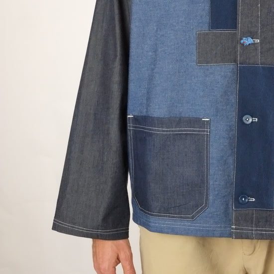 a patchwork denim jacket on a white background 