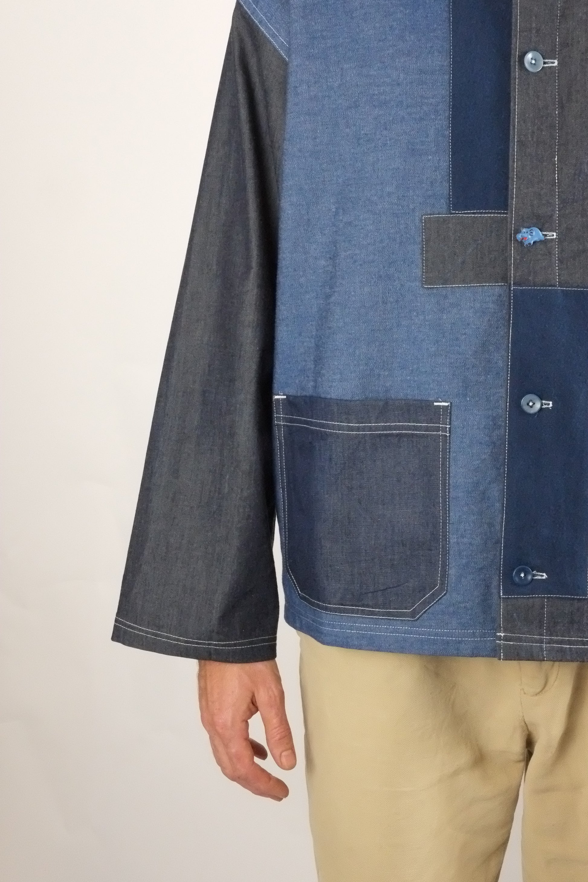 a patchwork denim jacket on a white background 