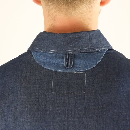 a patchwork denim jacket on a white background 