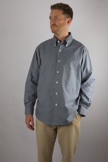 a patchwork striped shirt worn on a white background