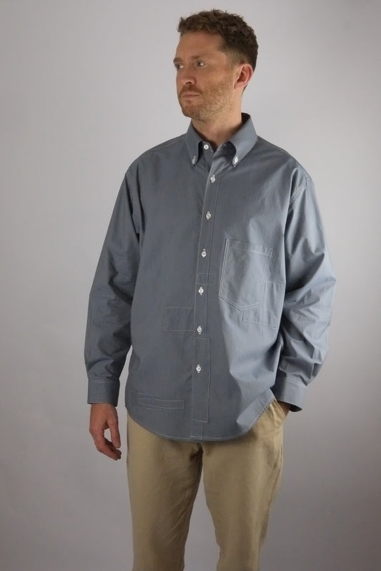 a patchwork striped shirt worn on a white background