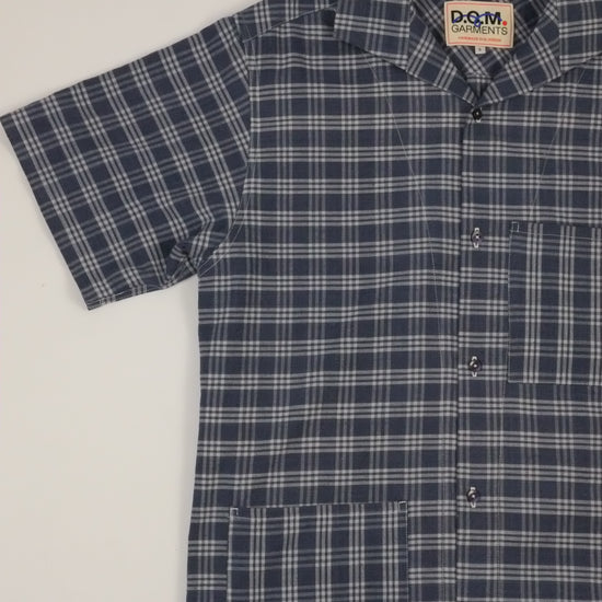 Plaid shirt with a brand label on a light background