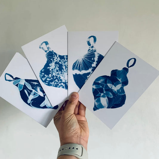 a selction of blue and white bauble cards on a white backround 