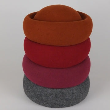 stack of wool, new york style berets 