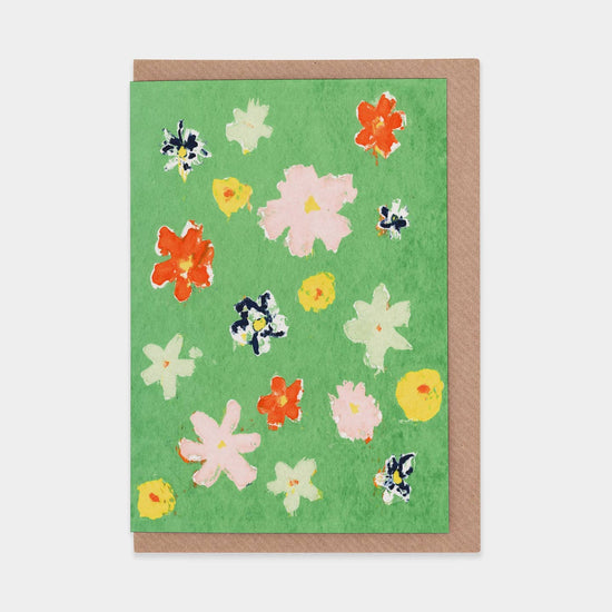 Greeting card with floral design on a green background