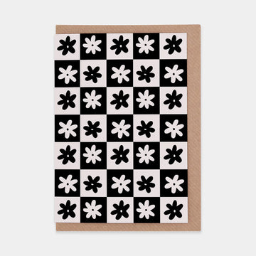 Monochrome checkerboard card with simple flower design and brown envelope 