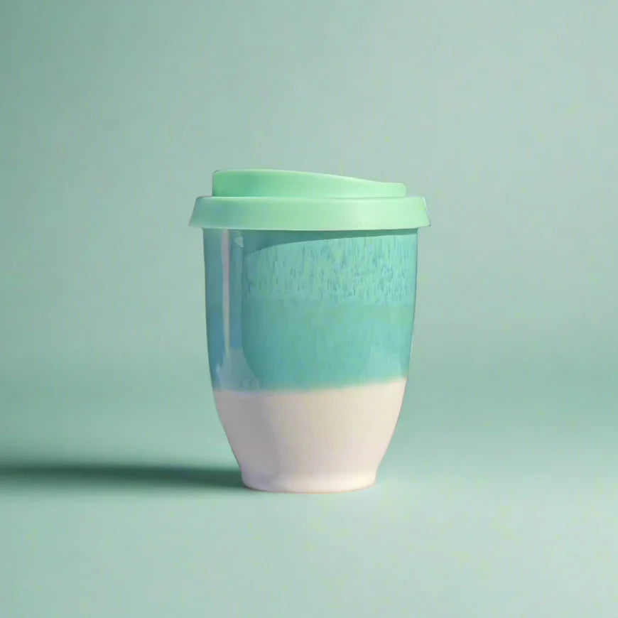 Two-toned mug with a green top and white bottom on a light green background