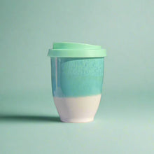 Load image into Gallery viewer, Two-toned mug with a green top and white bottom on a light green background
