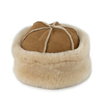 Tan colour sheepskin panelled hat sat upright on a white background