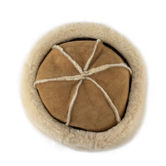 Birdseye view of 6 panel sheepskin hat in tan colour on a white background