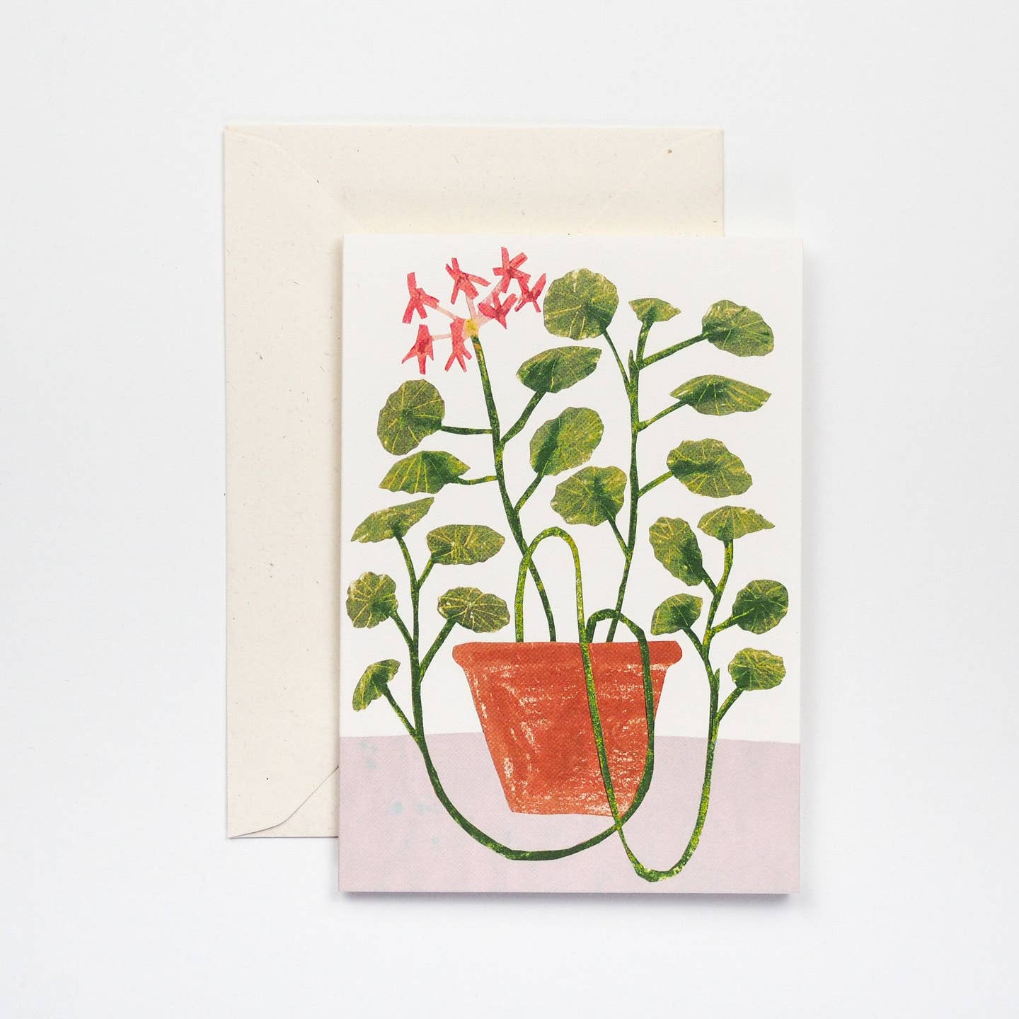 a card with geraniums on the front