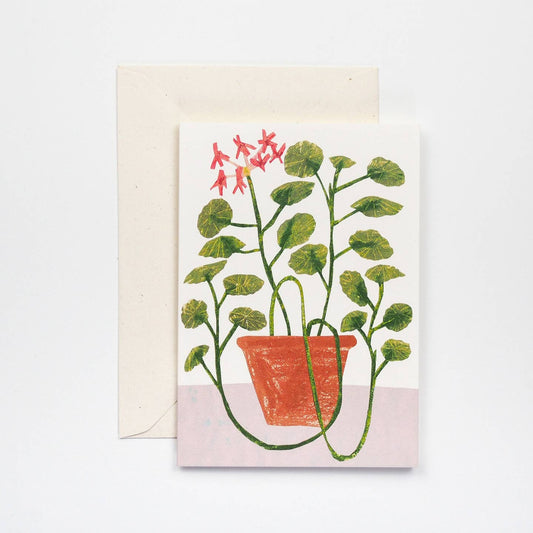 a card with geraniums on the front