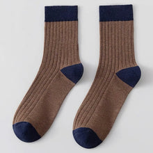 Load image into Gallery viewer, Pair of brown socks with navy accents on a light grey background
