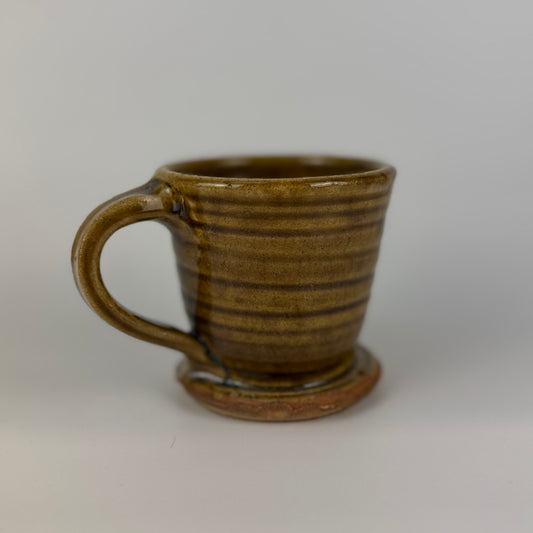 Brown ceramic mug on a white background