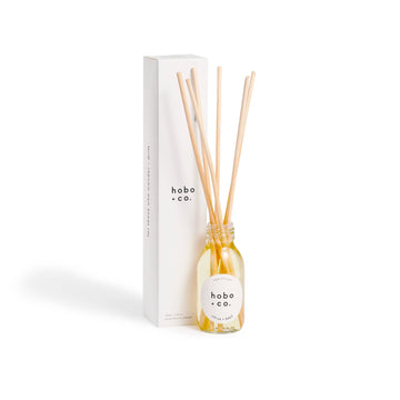 Hobo & Co. diffuser bottle with wooden sticks on a white background