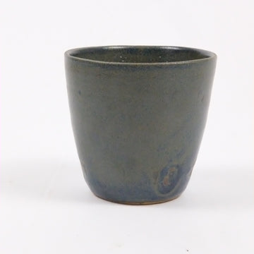 Dark gray ceramic cup on a white background