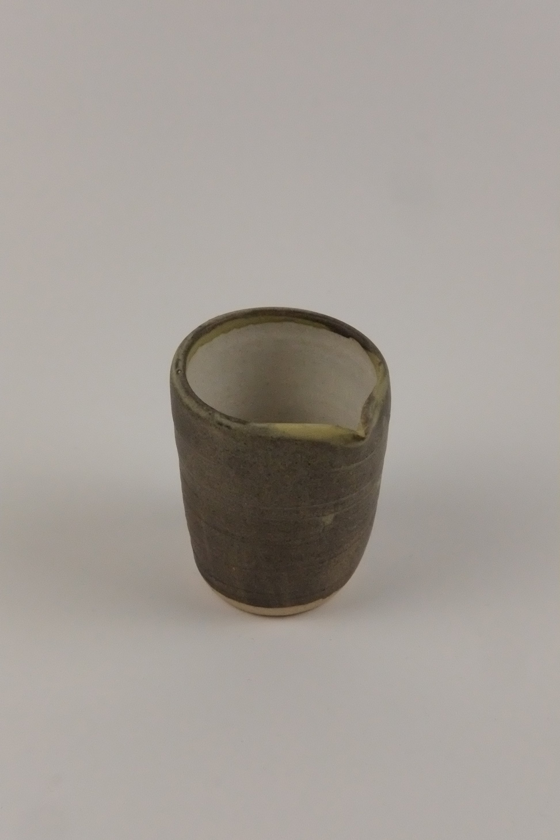 small milk jug and a white background