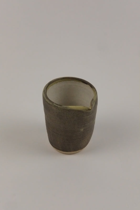 small milk jug and a white background