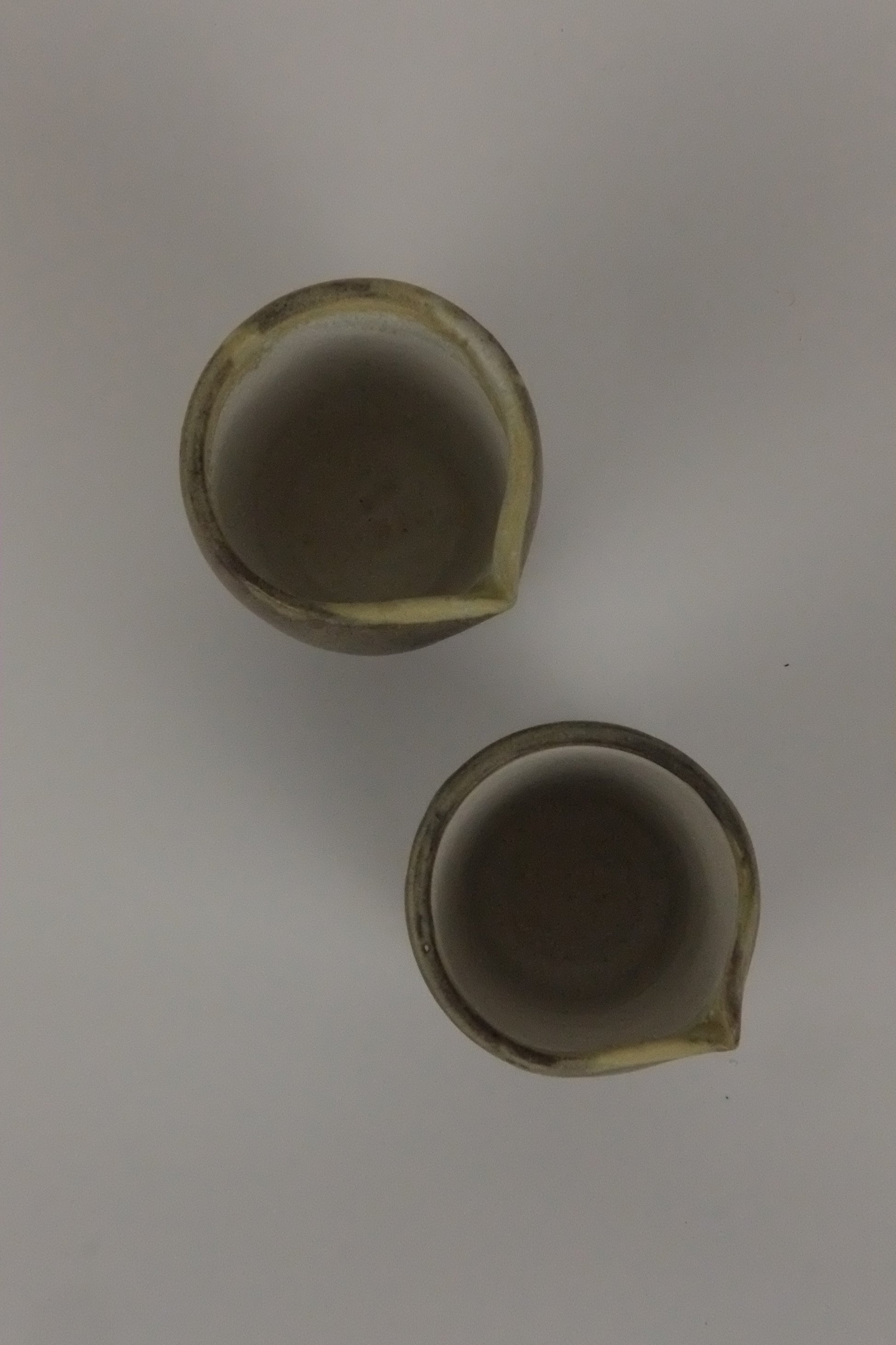 Two ceramic pots on a white background