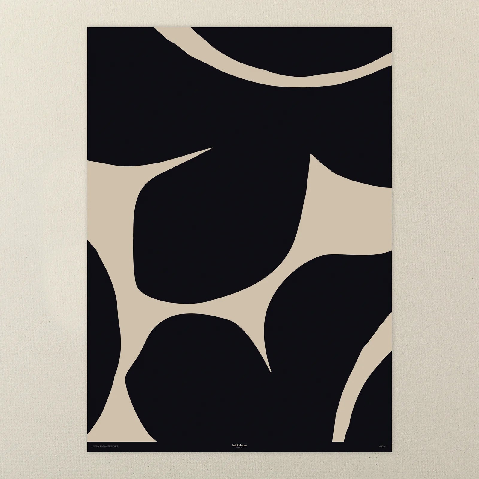Abstract gift wrap with black and beige shapes on a beige background