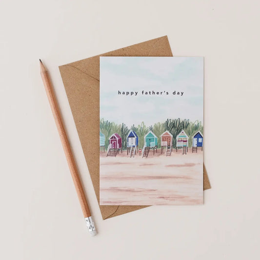 Father's Day card with beach huts illustration and pencil on beige background
