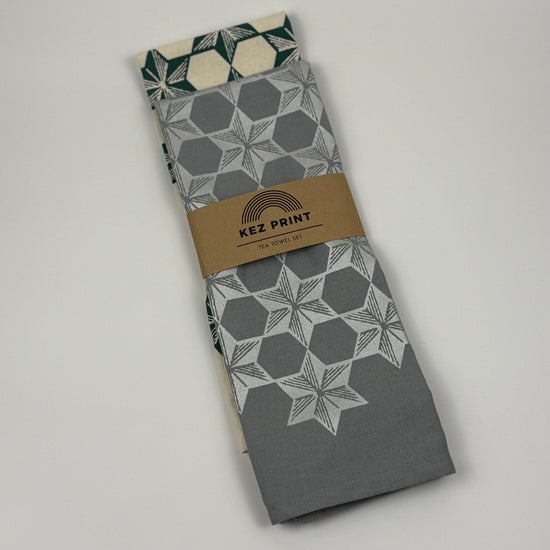 Packaged fabric with geometric patterns and 'KEZ PRINT' label on a gray background