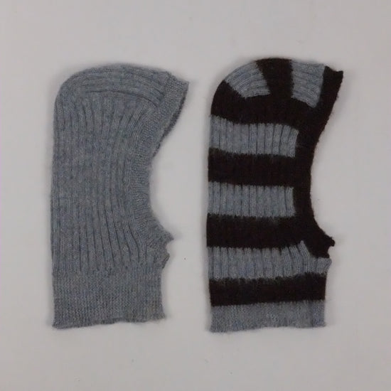 Two knitted balaclava, one gray and one black and gray striped, on a white background.