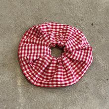 Load image into Gallery viewer, Red and white checkered scrunchie on a gray concrete surface
