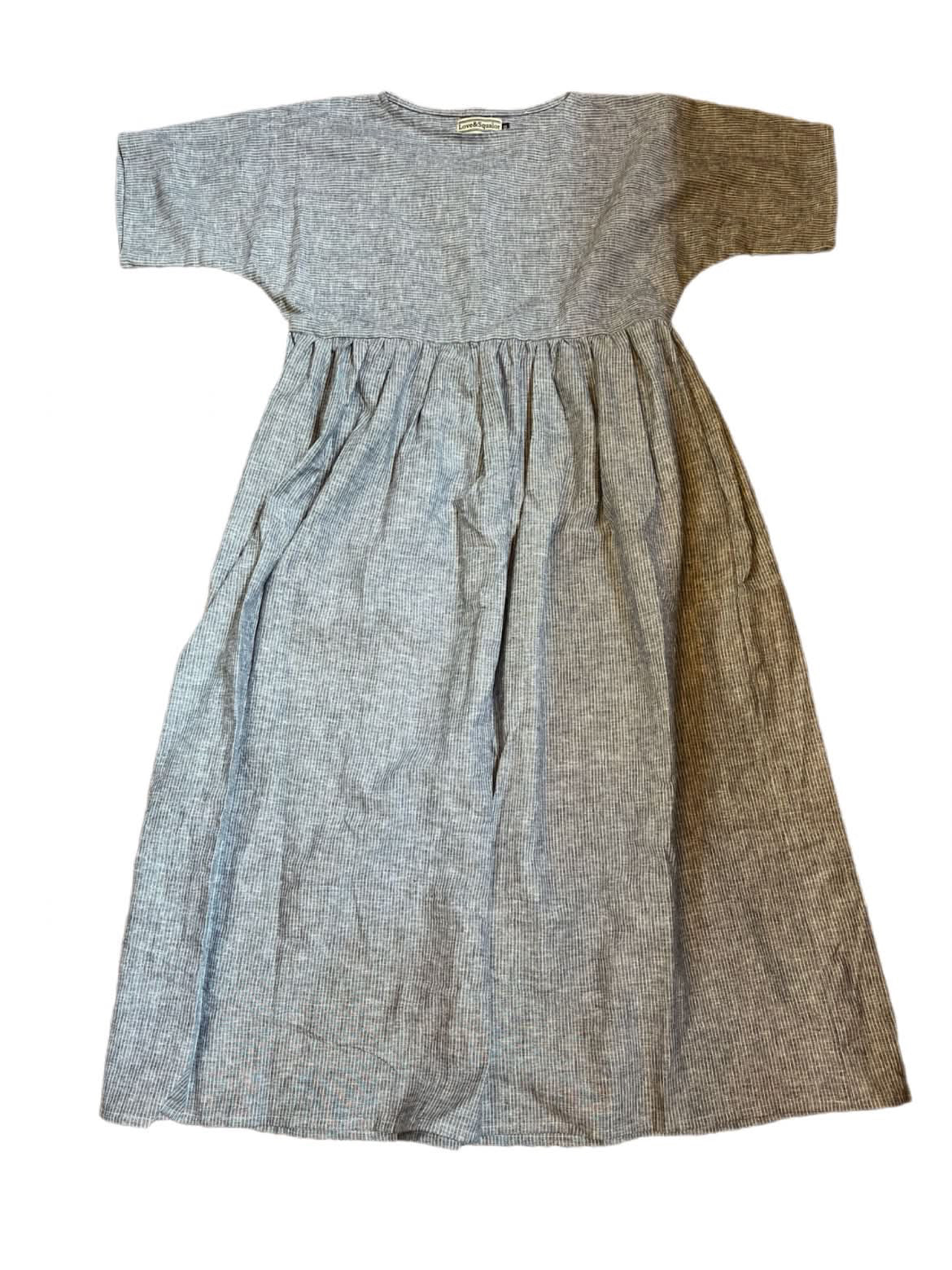 Blue and white batwing maxi smock dress with a gathered waist with a white background