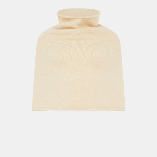 A cream poncho on a white background 