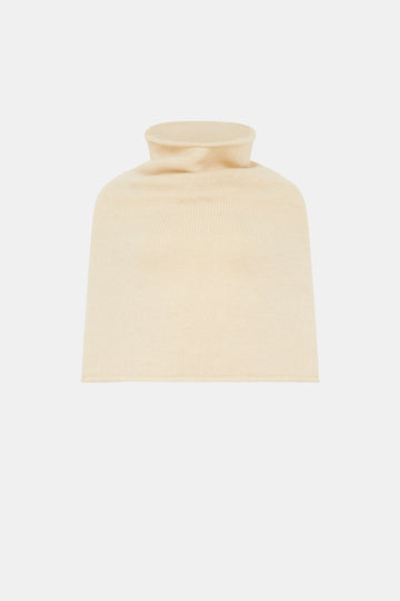A cream poncho on a white background 
