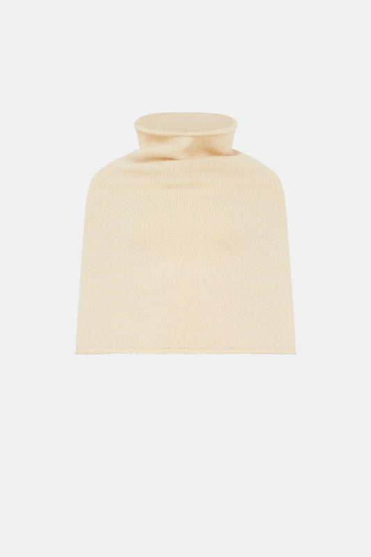 A cream poncho on a white background 