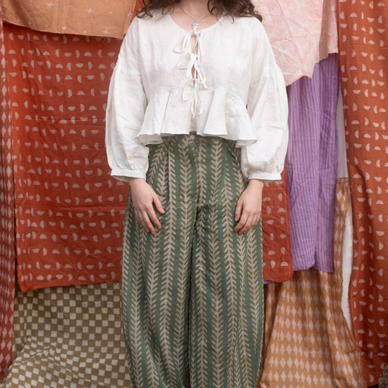 woman wearing the holiday jeans in aloe