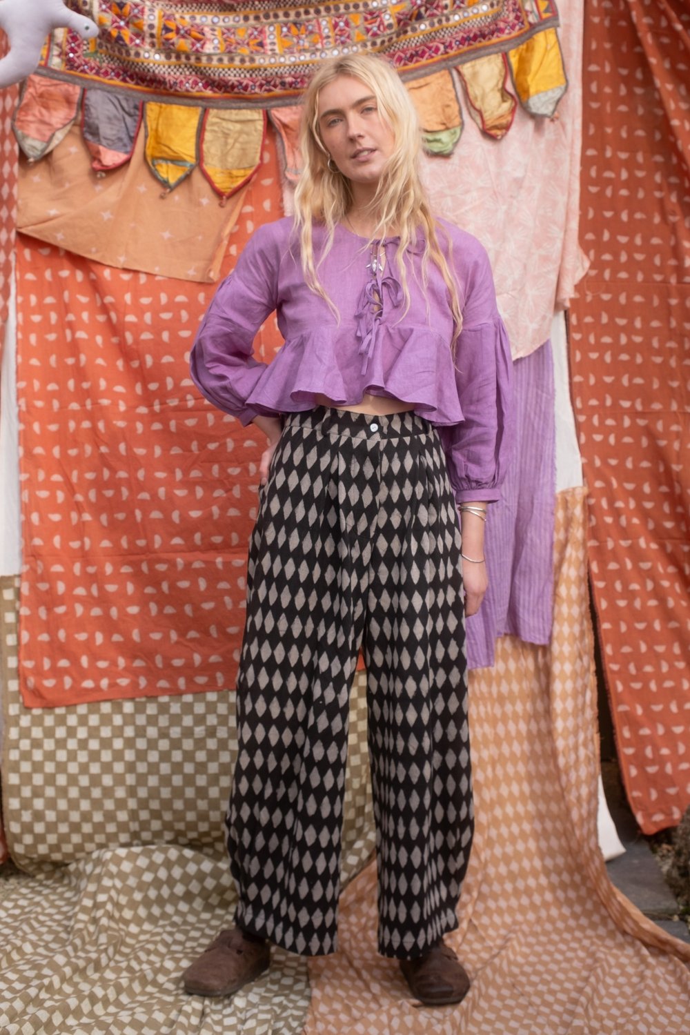 woman wearing black iron holiday jeans