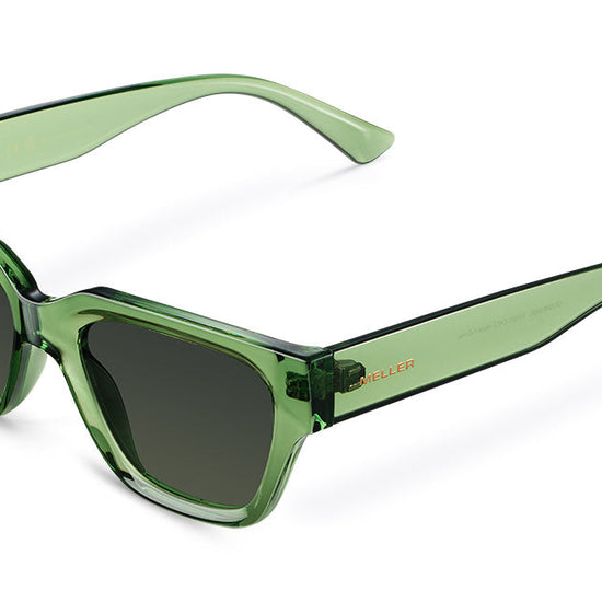 Green sunglasses on a white backgorund