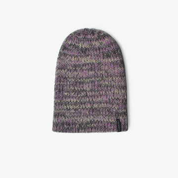 A knitted beanie in purple hues on a white background 