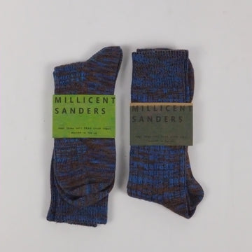 Pair of socks with a visible brand label on a white background