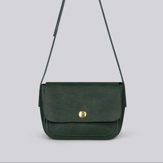 A dark green leather crossbody bag with a long adjustable strap and a gold snap button closure, shown against a solid light grey background.
