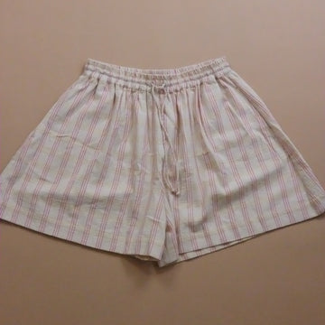 Checkered shorts on a beige background