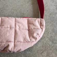 Load image into Gallery viewer, Pink quilted bag with red stitching on a gray surface
