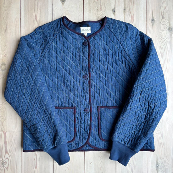 A blue jacket on a wooden background 