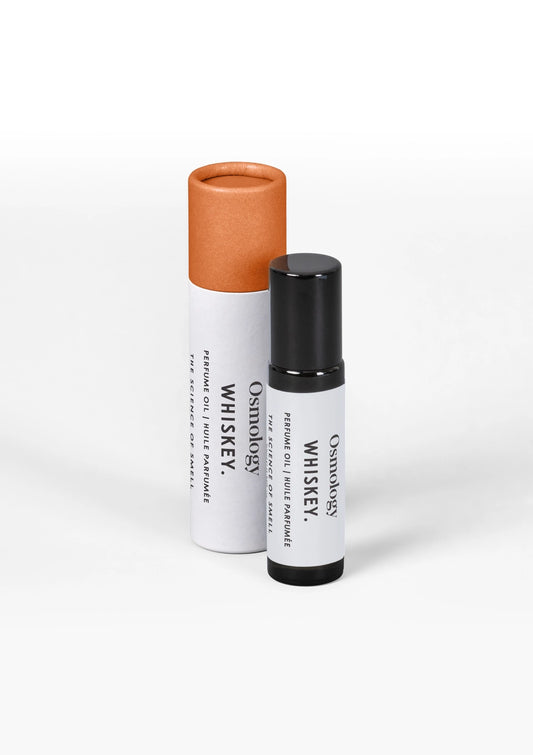 A small white cylindrical bottle with a black cap stands in front of a larger white tube with a copper-orange cap. Both containers are labeled 'Osmology Whiskey' on a clean white background.